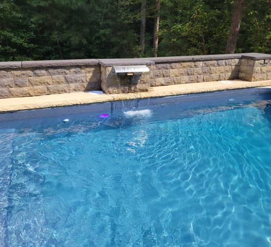 Beautiful Blue water in pool with waterfall